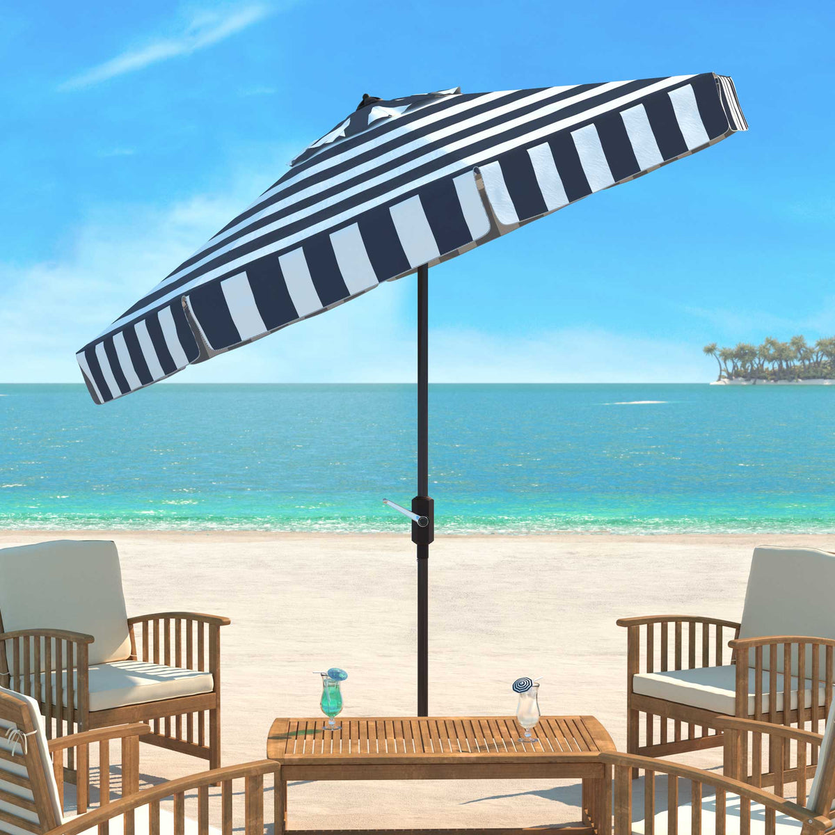 A tilted navy-and-white canopy shades an outdoor table and chairs beside the water.