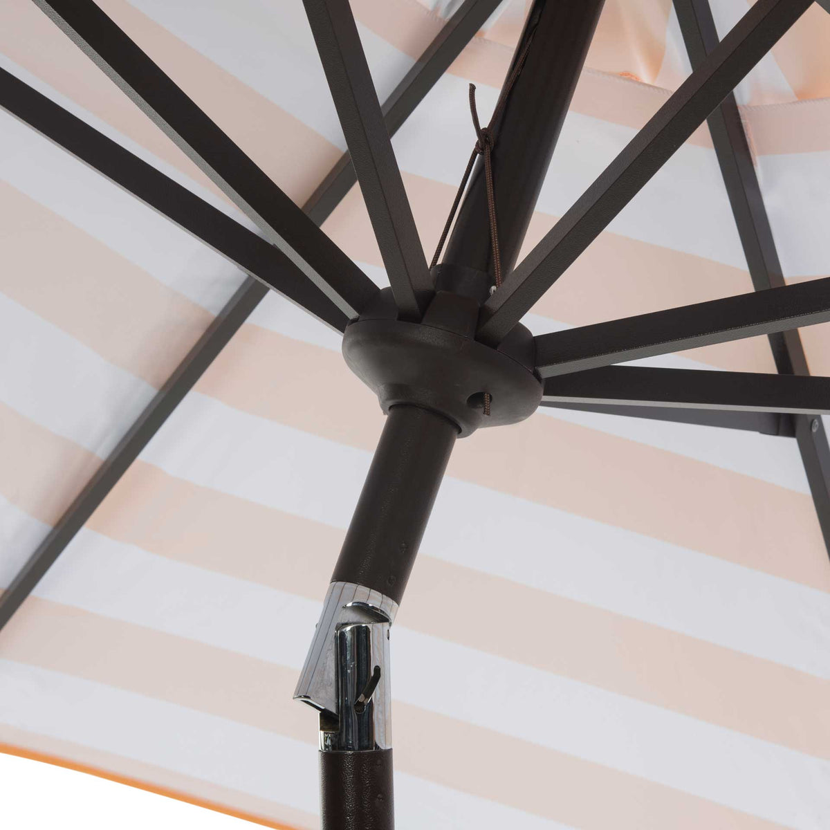 Dark ribs and a silver tilt joint support the orange-striped canopy.