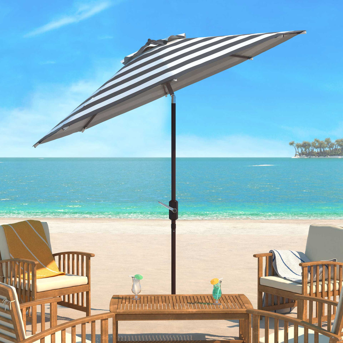 A striped canopy shades an outdoor table and cushioned chairs beside the water.