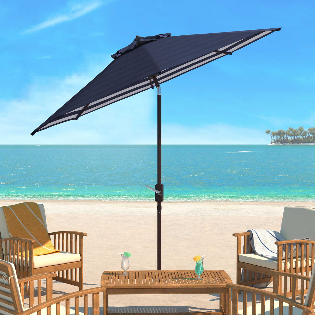 A navy tilting umbrella provides inviting shade for a relaxed seaside lounge.