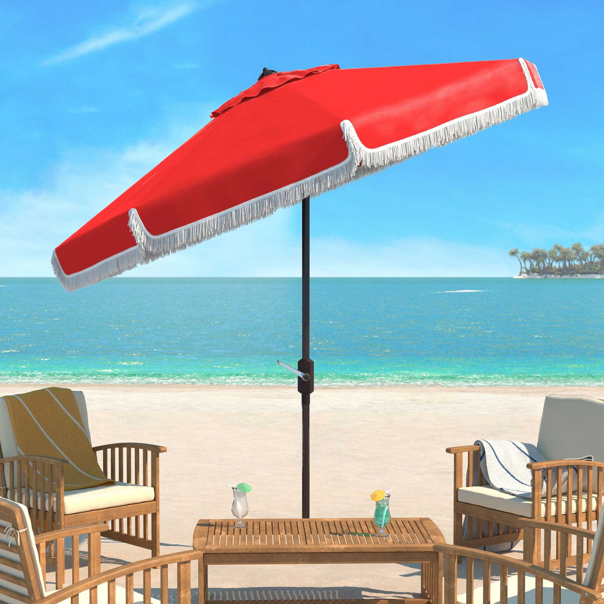 A tilted red umbrella with playful white fringe shades beachside patio seating.