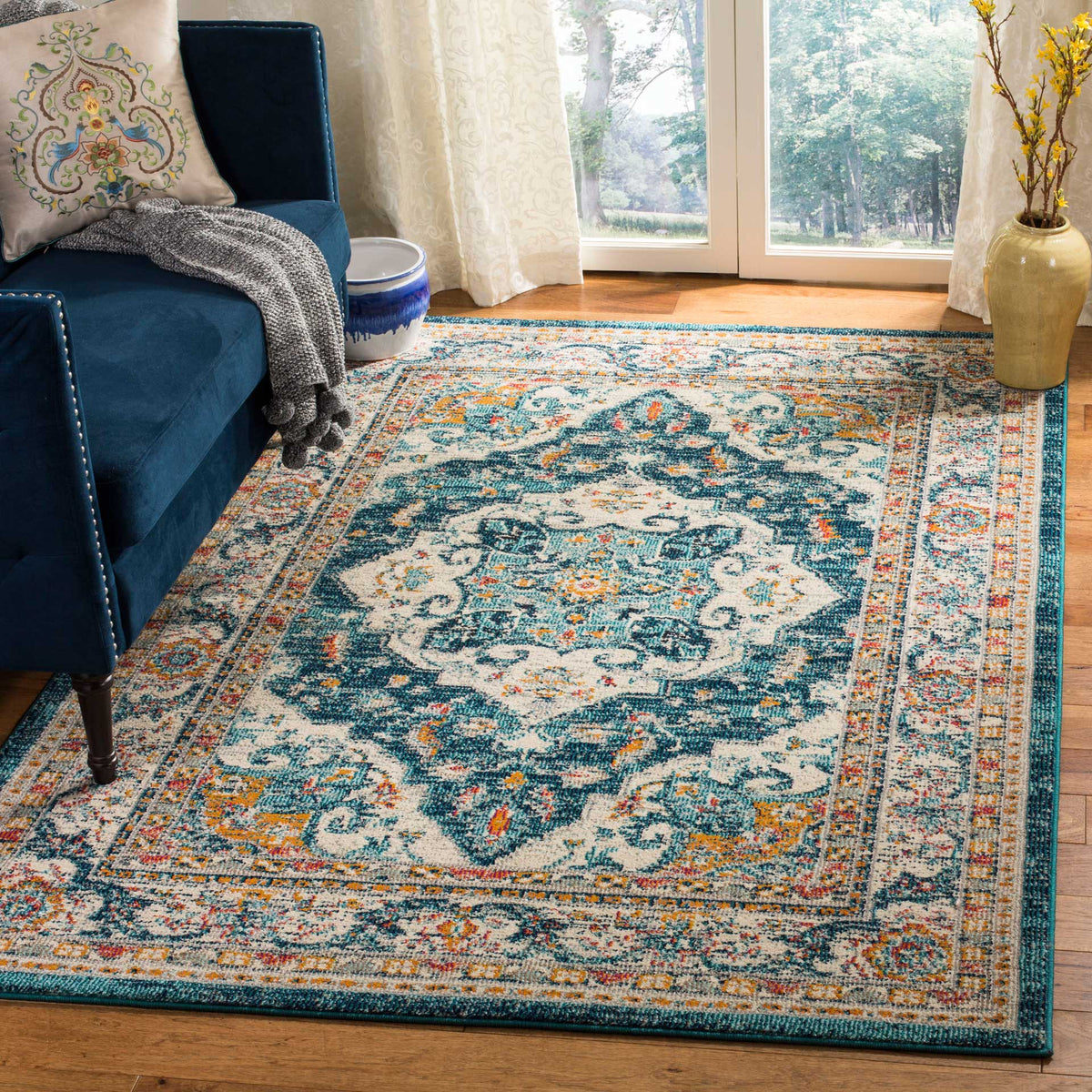 An ivory medallion and deep blue floral motifs bring traditional color to the living space