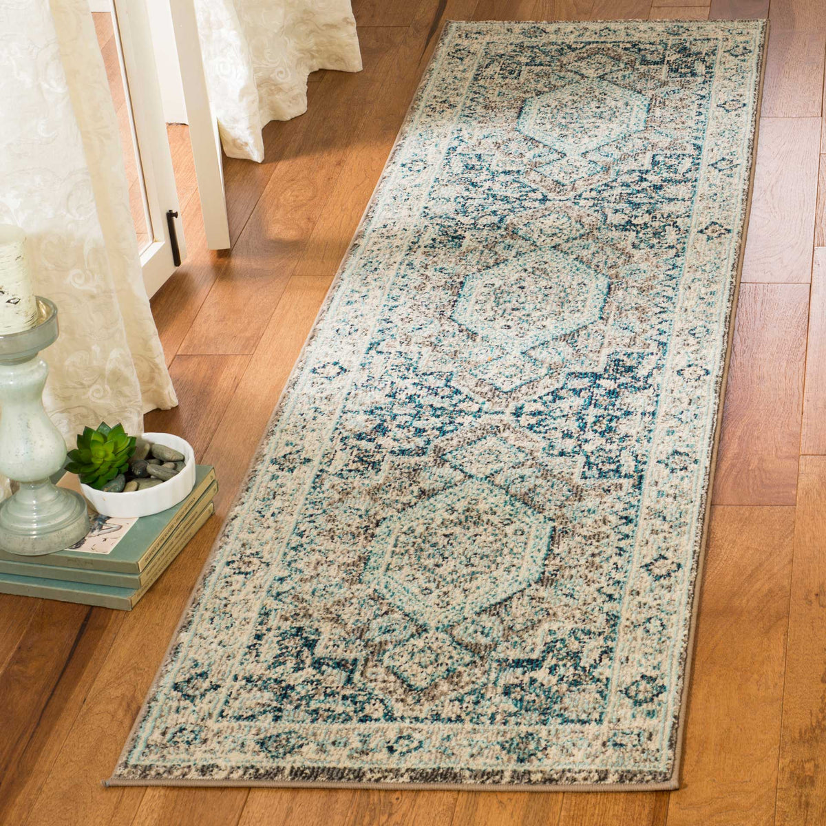 Softly faded blue medallions lend vintage character to this narrow runner rug