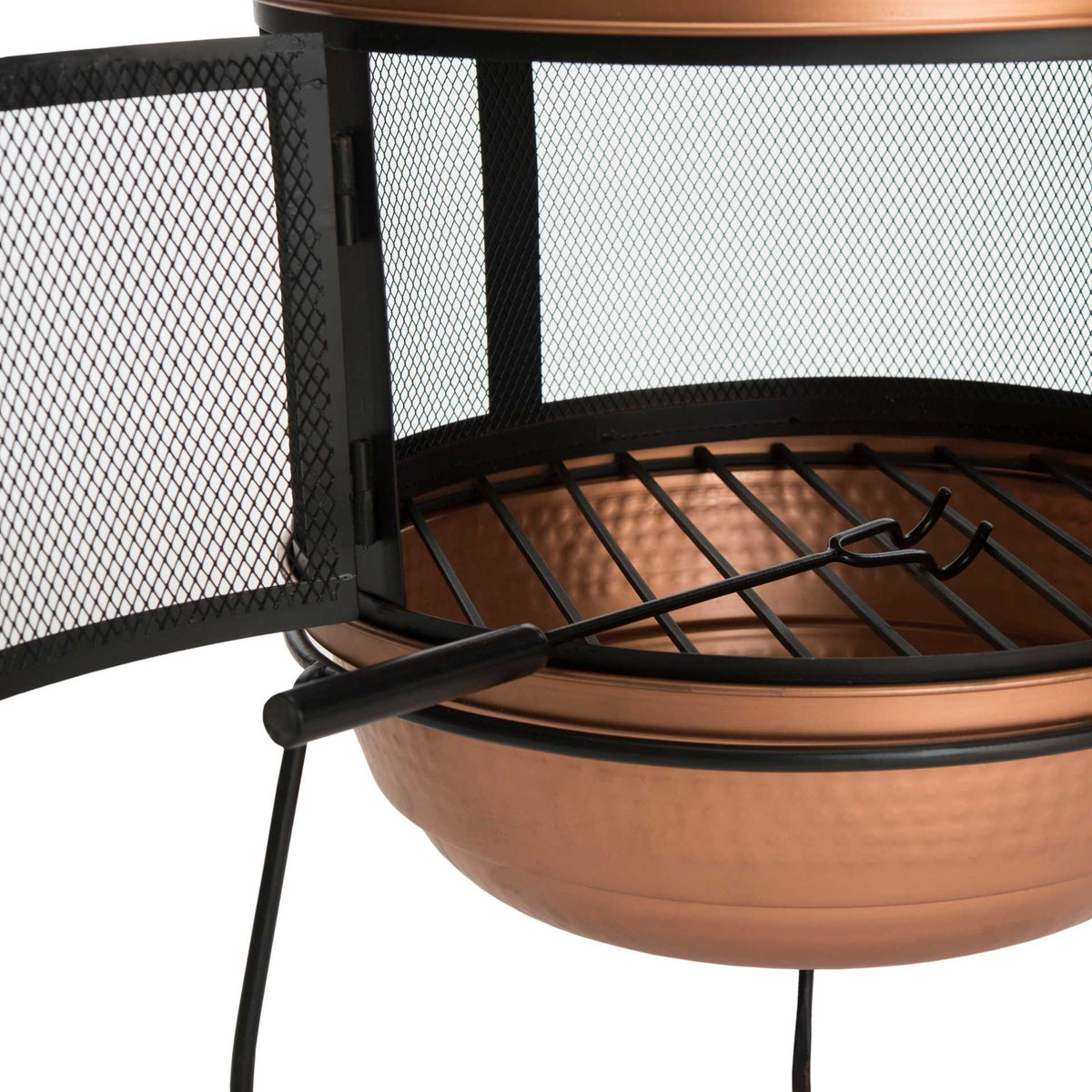 An open mesh door frames the fire grate and included poker above the copper bowl