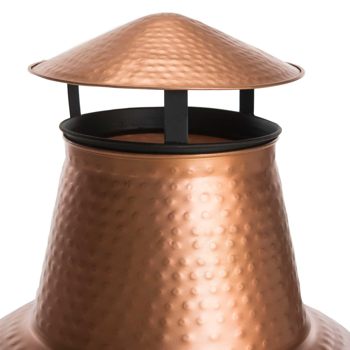 A vented copper chimney cap and tapered flue showcase the hammered finish