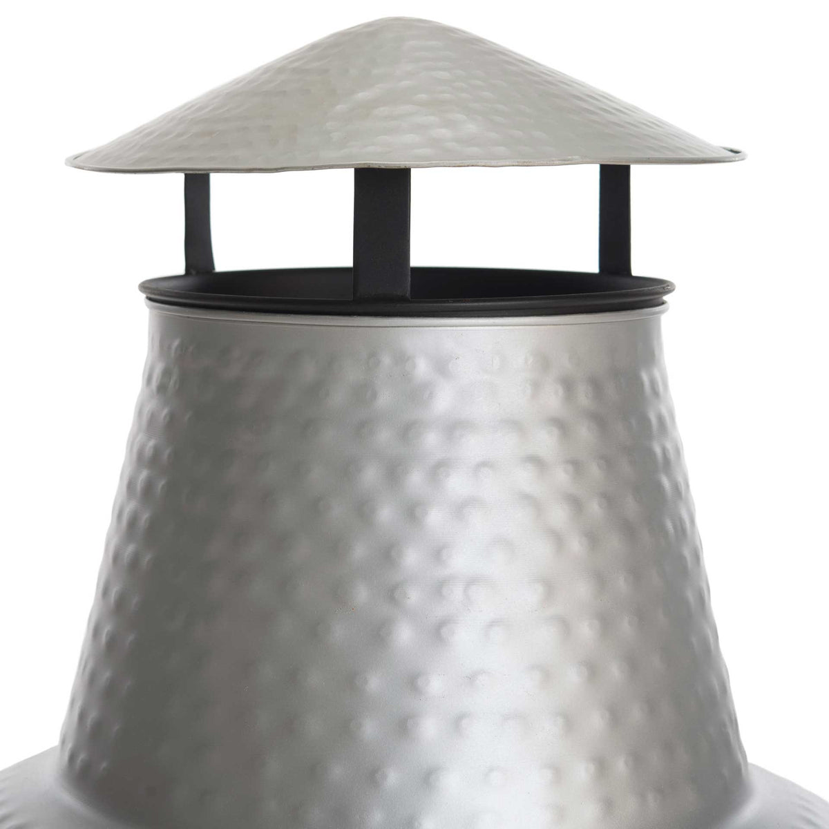 Hammered silver metal adds texture to the tapered chimney and vented cap.