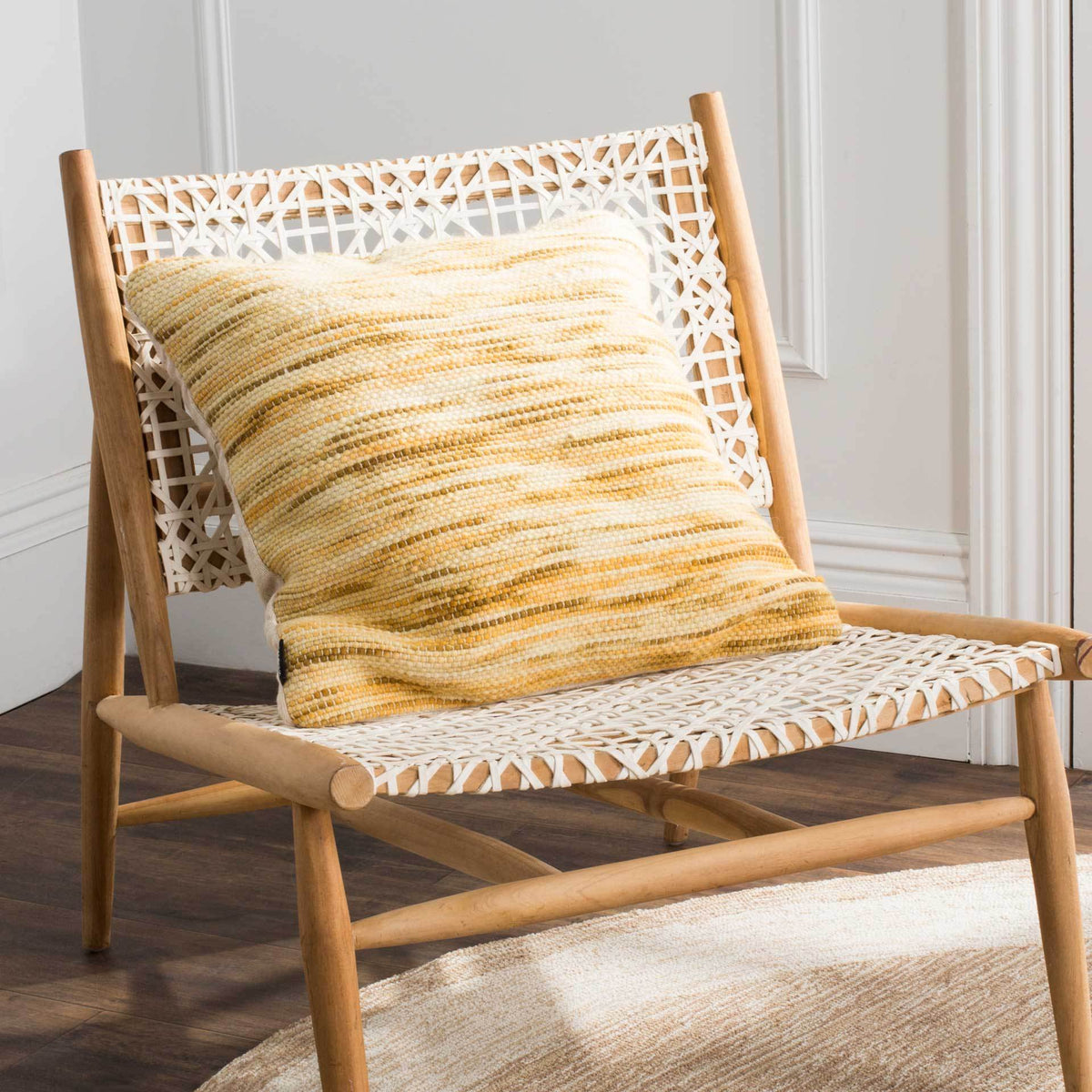 Golden stripes bring warmth and texture to a woven accent chair