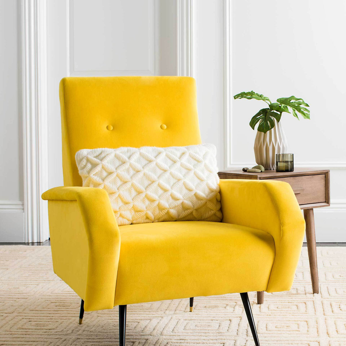 Textured ivory lumbar pillow adds soft diamond detail to a vibrant yellow chair