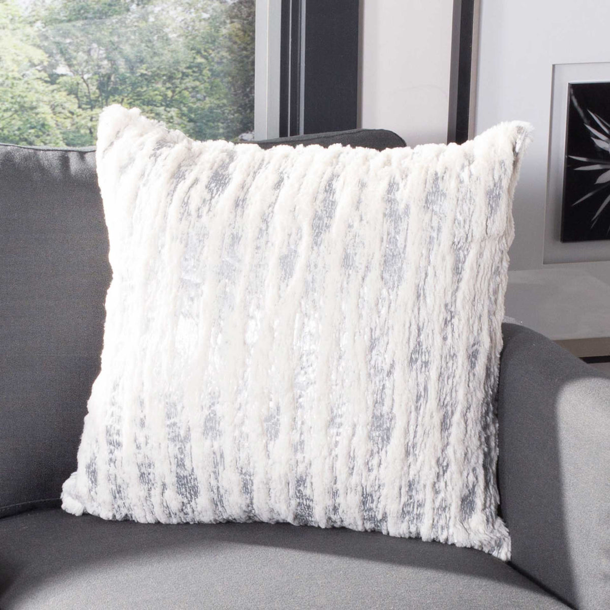 Plush white and silver pillow with soft vertical ridges and cozy texture