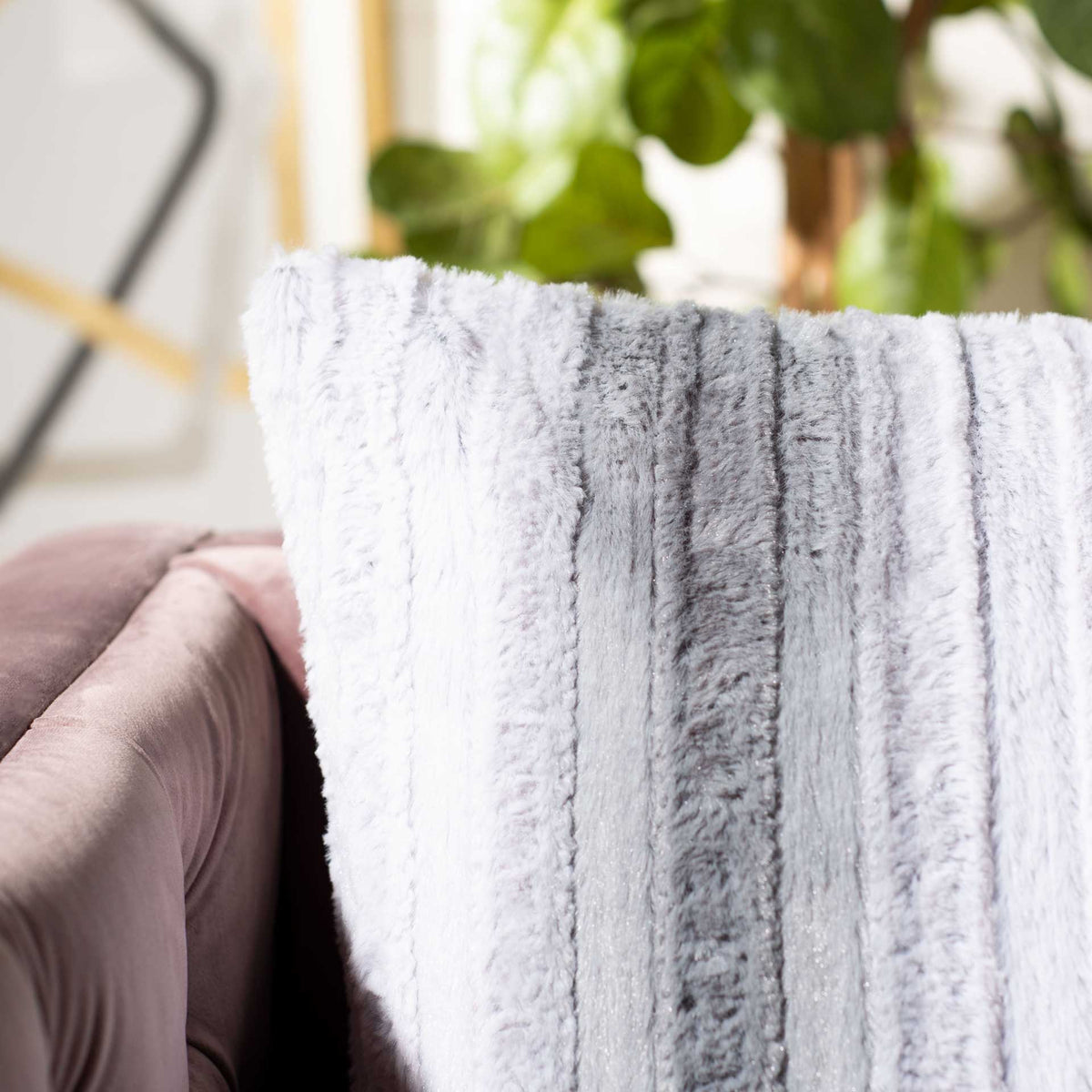 Soft, raised stripes add touchable texture and subtle depth to the pillow