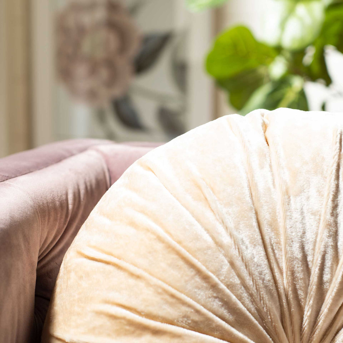 Shimmery creme fabric gathers into soft pleats for a richly textured accent