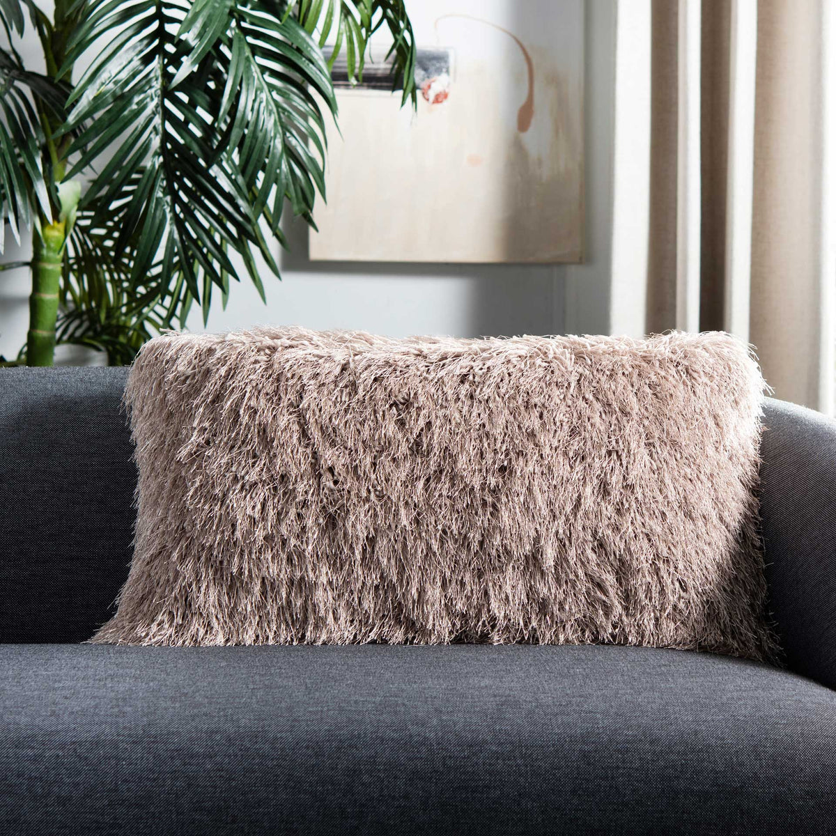 Bronze shag lends soft shimmer and plush texture to a dark sofa.