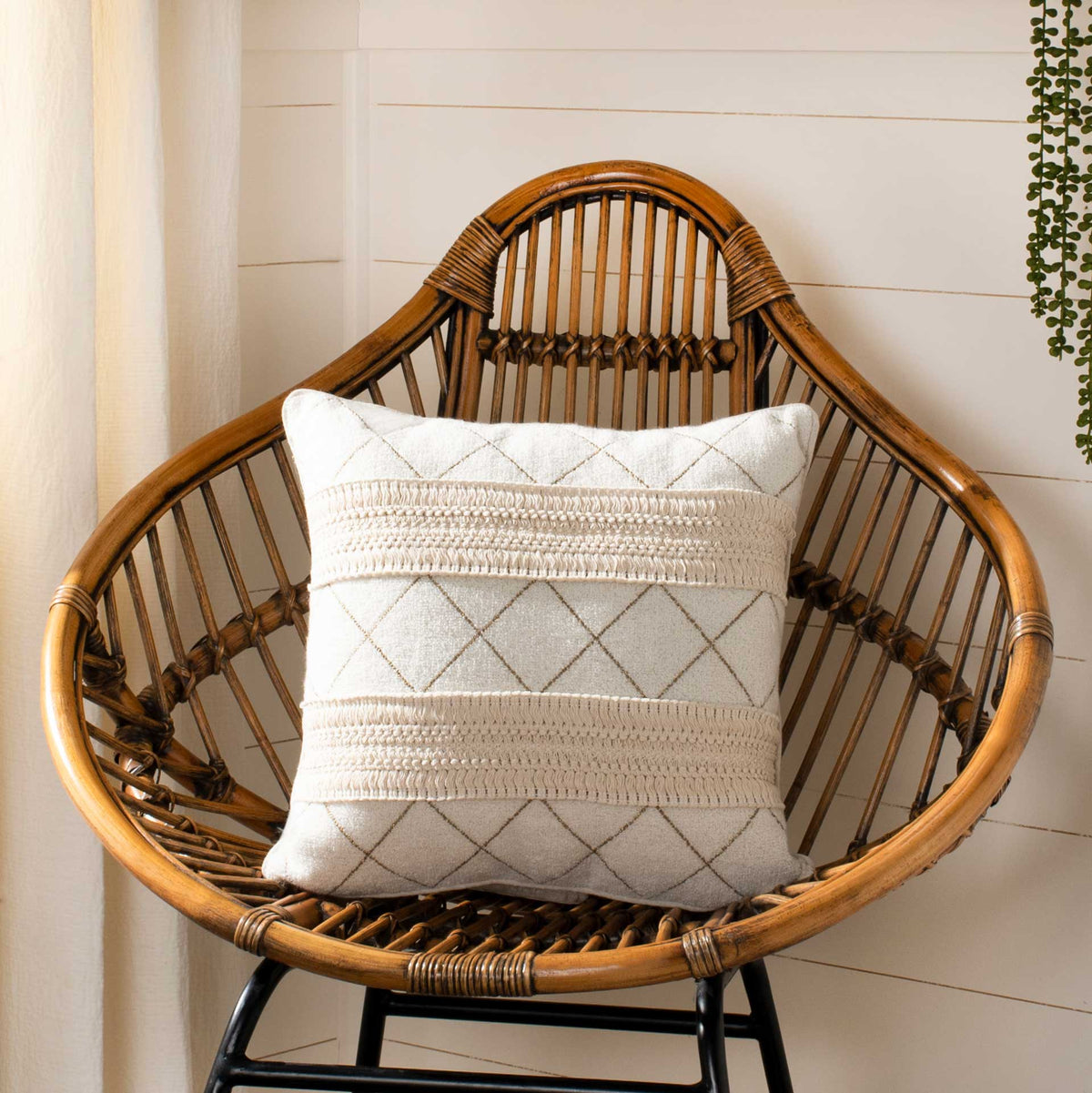Cream pillow pairs diamond stitching with textured bands for a relaxed bohemian look.