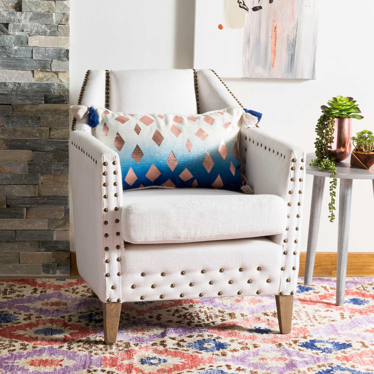 Blush diamonds and an ivory-to-blue fade add a colorful accent to an upholstered chair