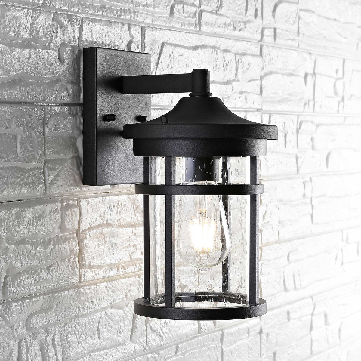 Clear glass surrounds the illuminated bulb beneath a black domed canopy