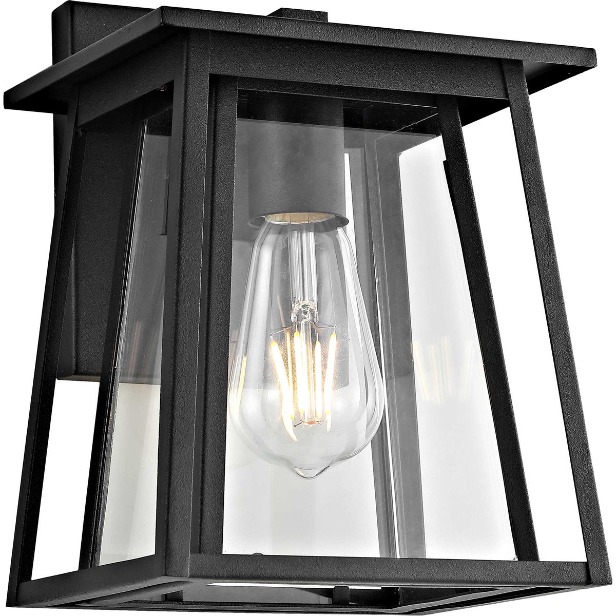 A glowing filament bulb shines through clear glass panels in a black metal wall lantern.