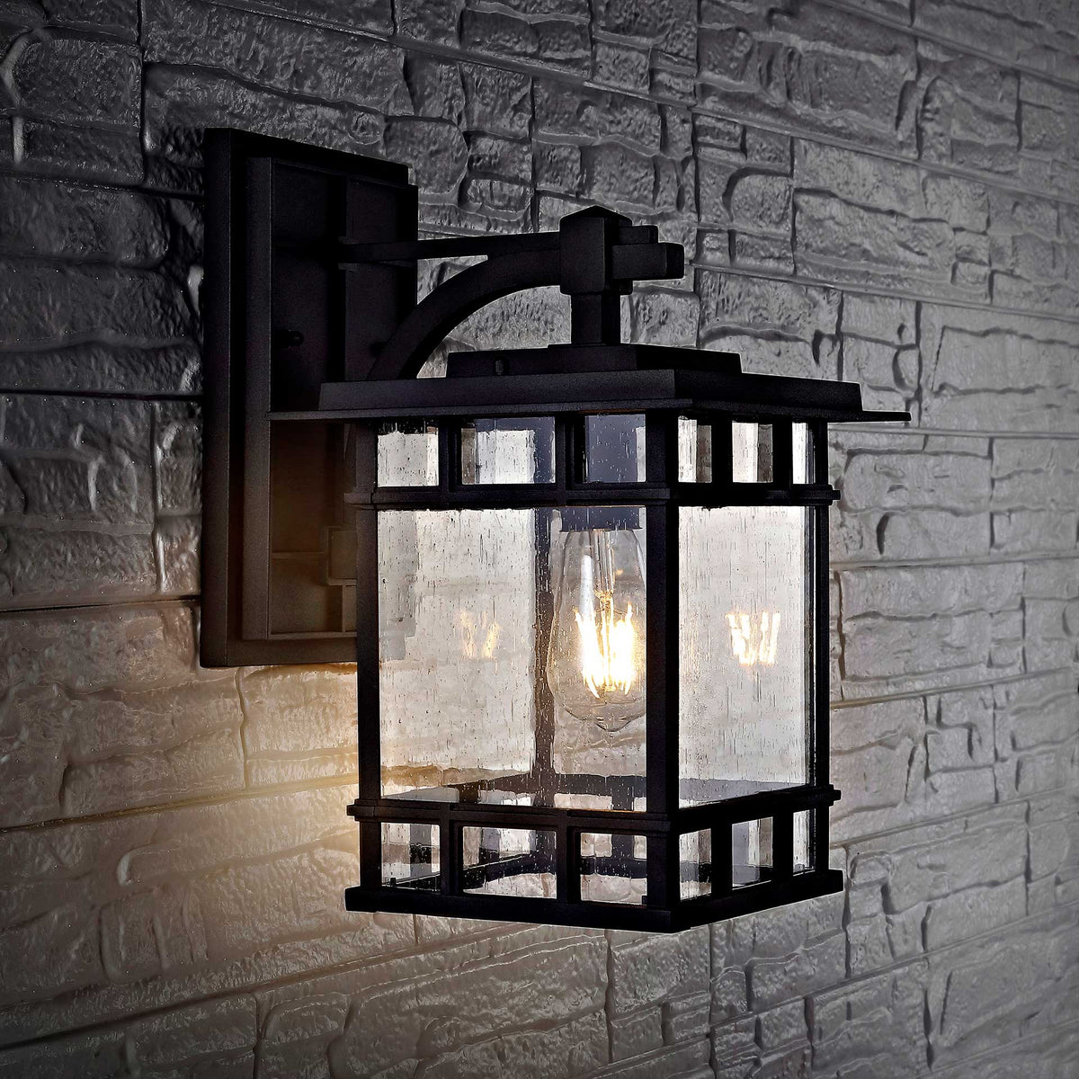Warm light shines through clear glass panes framed by bold black metal gridwork.