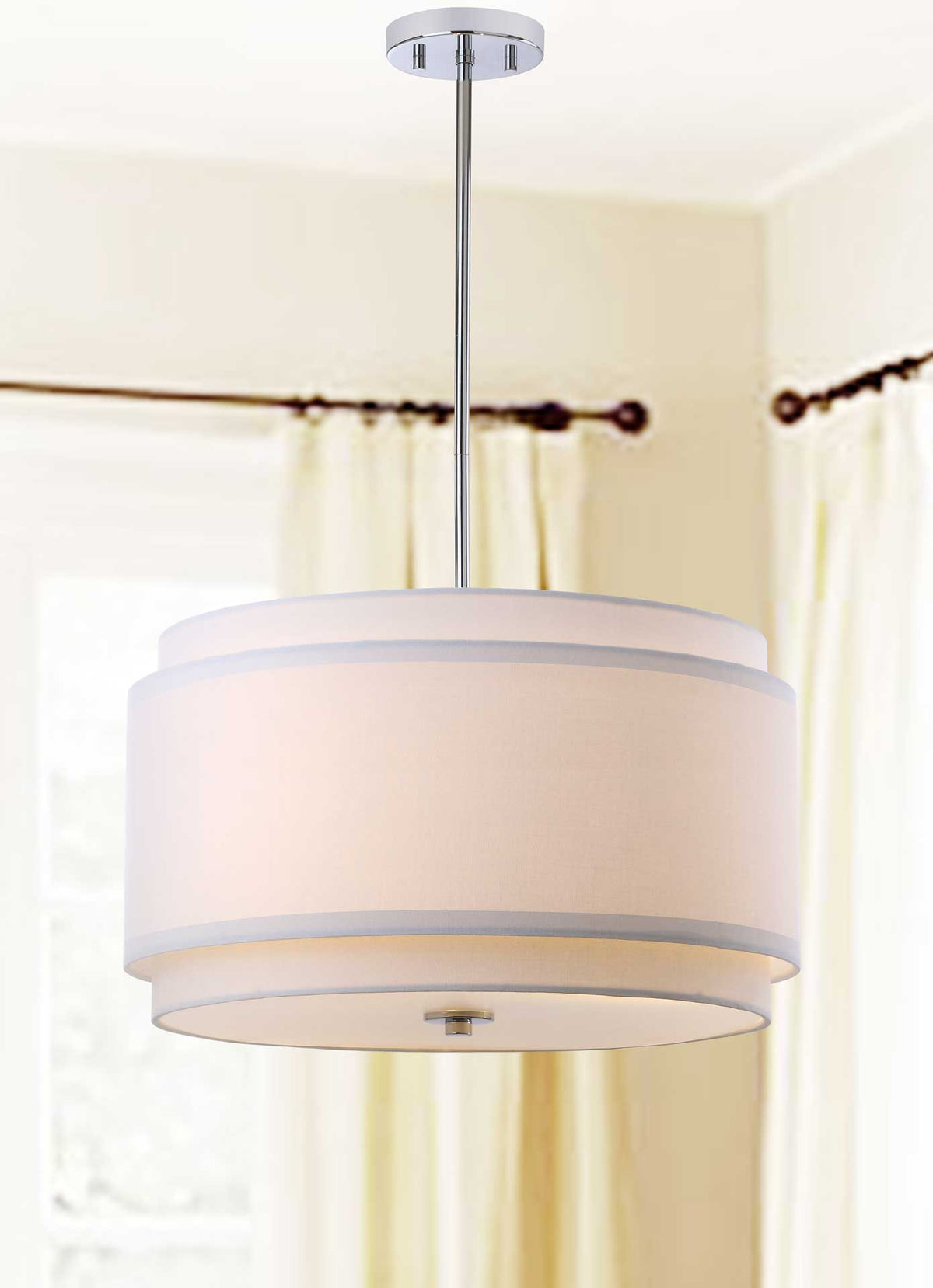 A soft, warm glow fills the layered white shade of this chrome pendant.