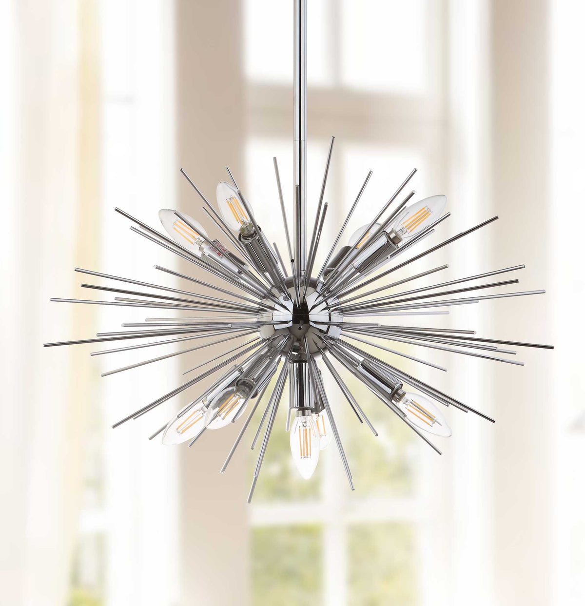 Slender metal rays surround clear bulbs in a sculptural starburst.