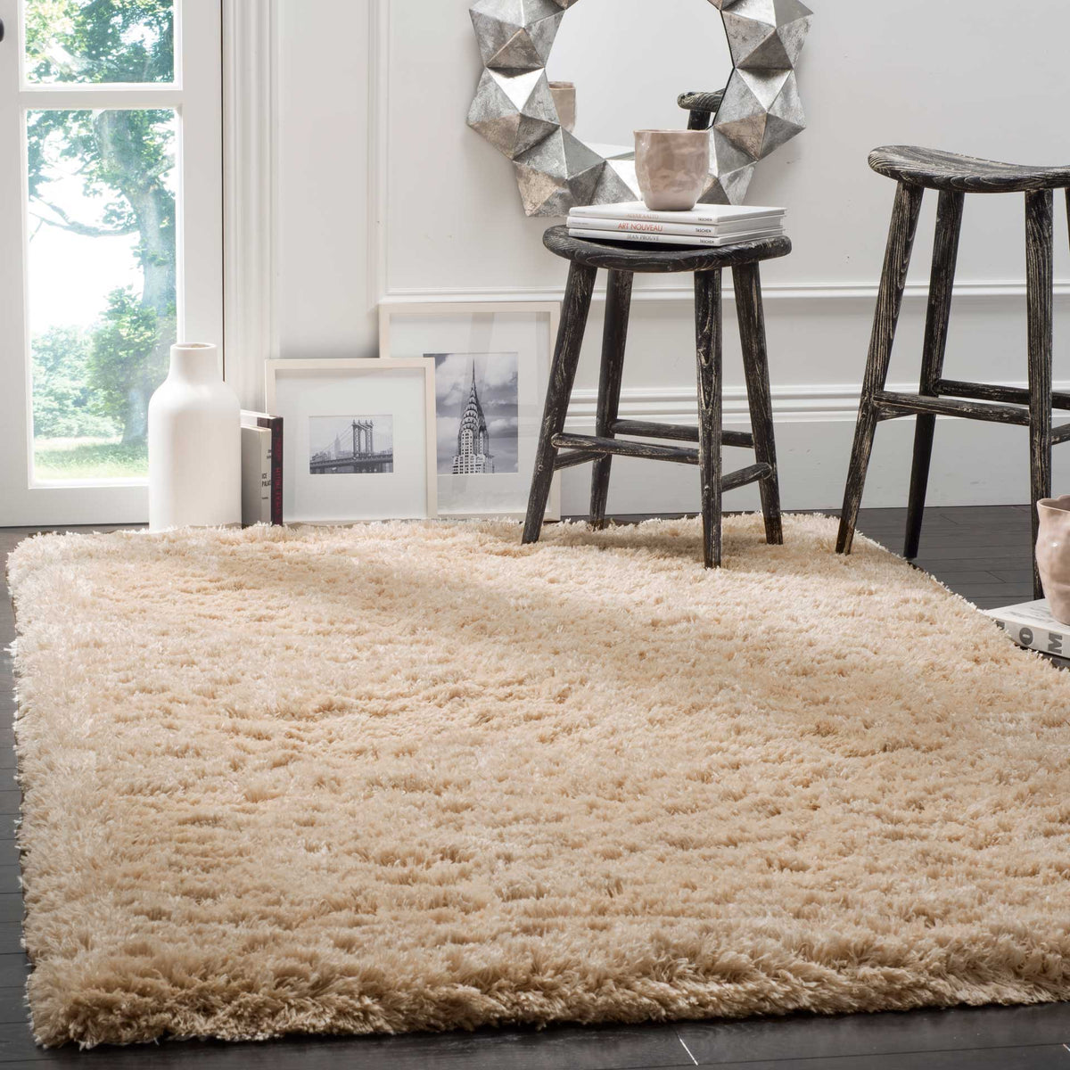 A light beige shag rug brings plush warmth and inviting texture beneath accent furniture.