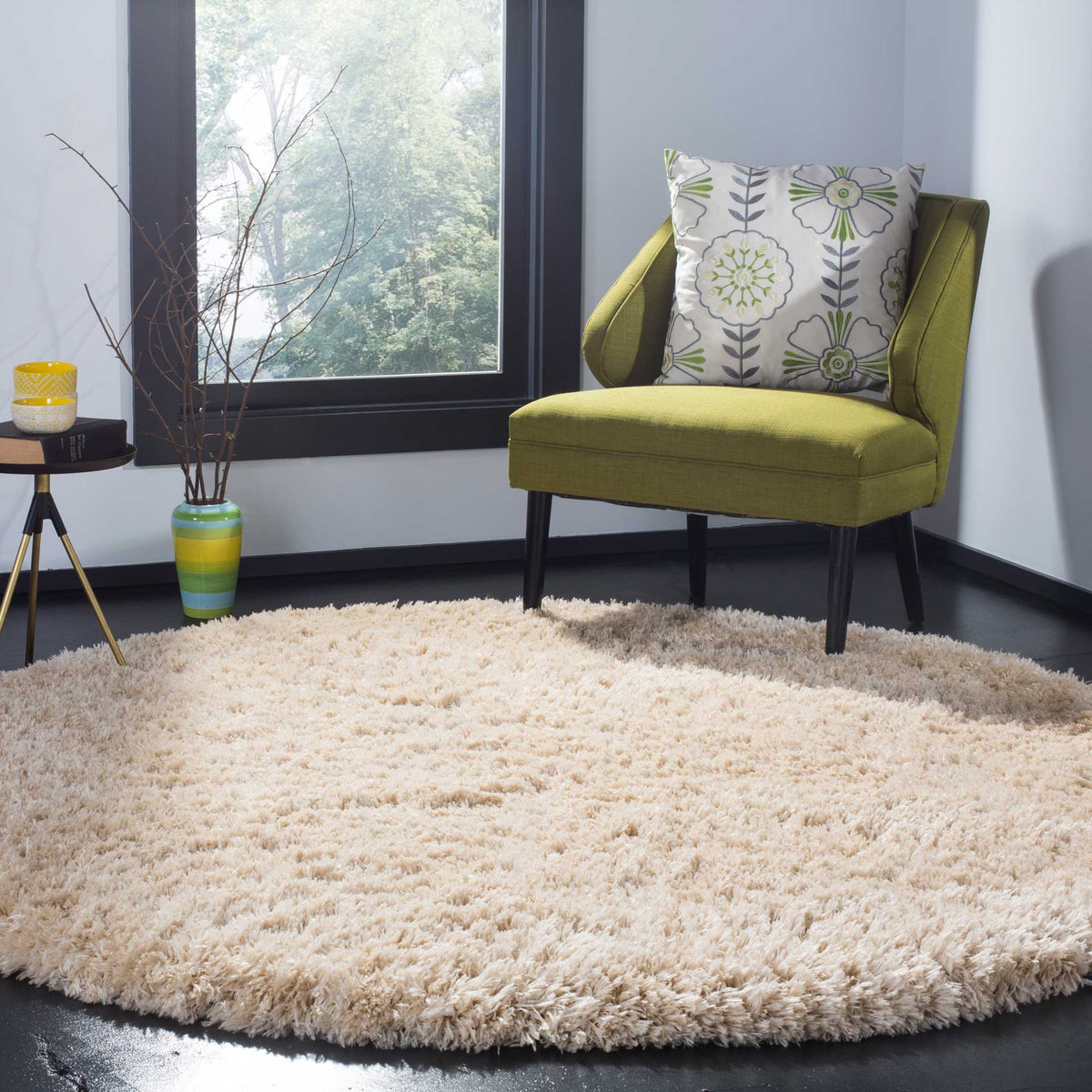 A plush light beige round rug adds soft texture beneath an accent chair