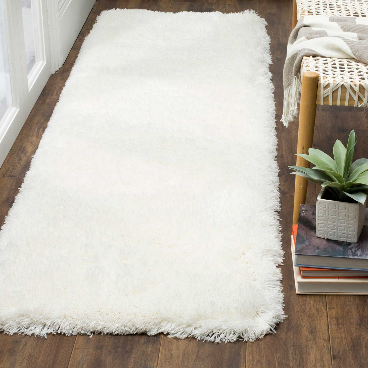 Dense white shag creates a soft, cloudlike surface with feathery edges