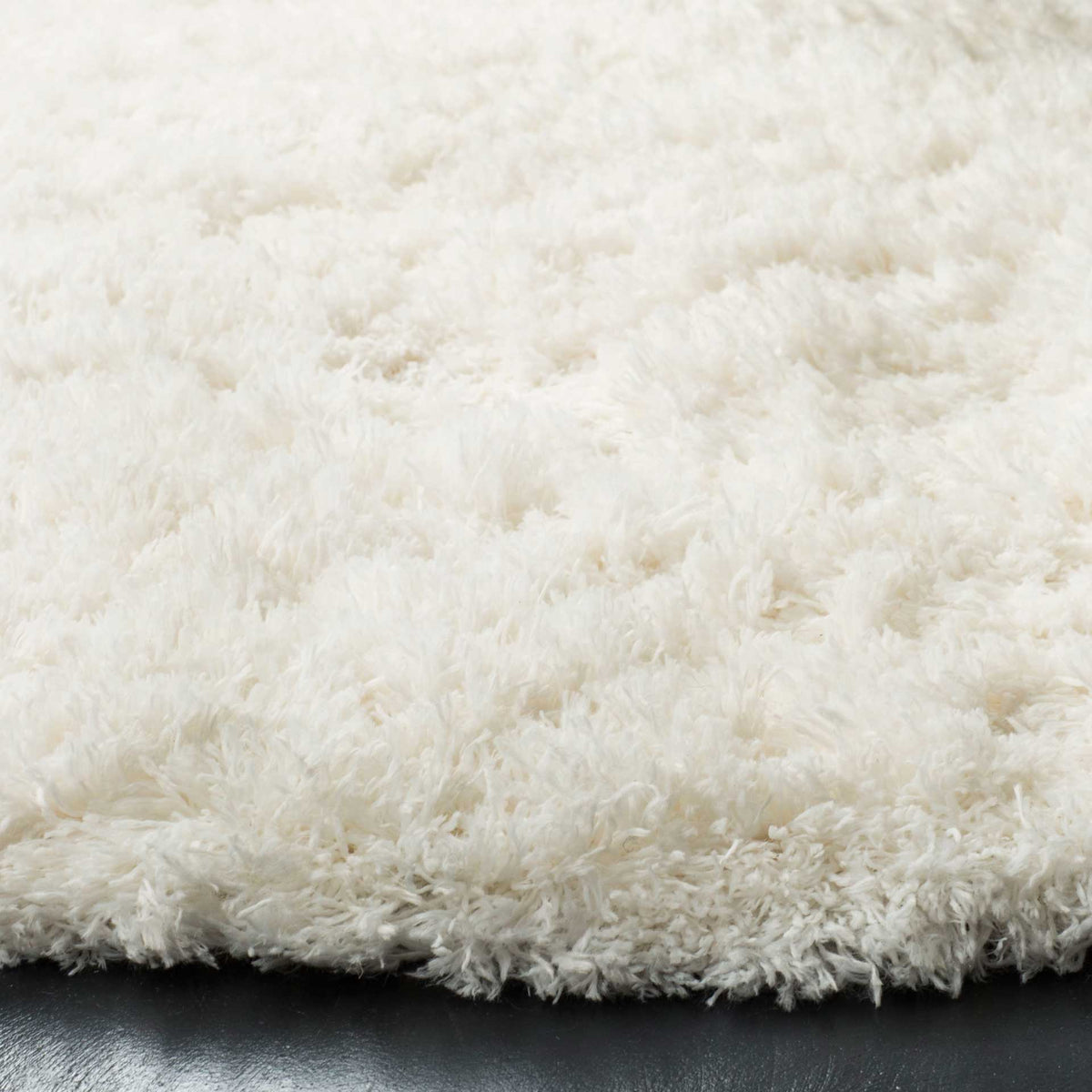 A thick white shag pile adds cloudlike texture along the rug's edge