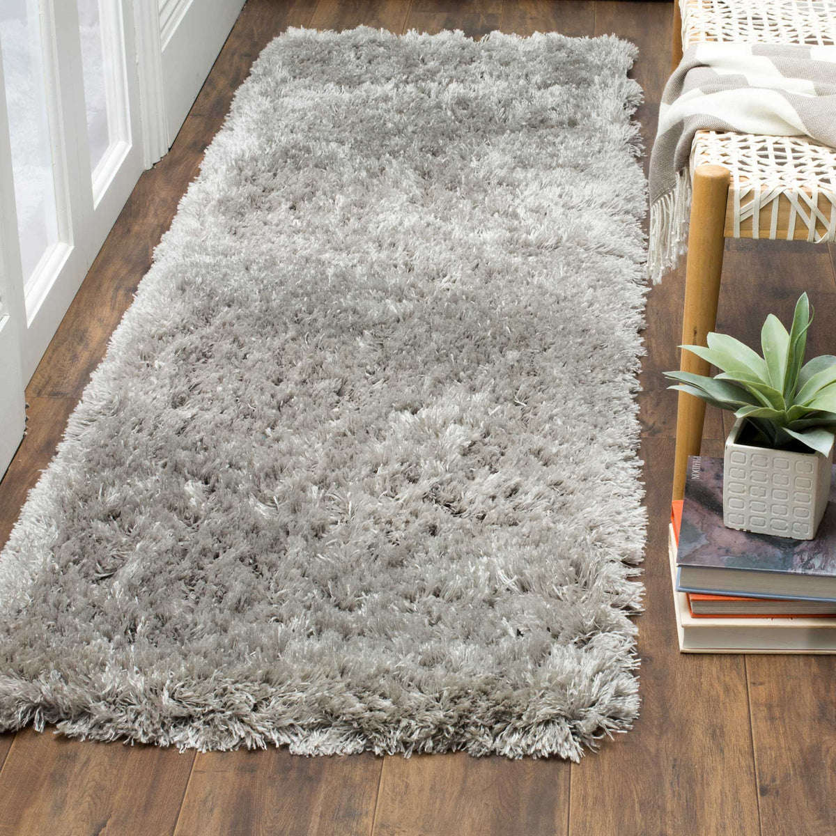 Deep silver shag brings soft texture and a subtle sheen to a wood floor