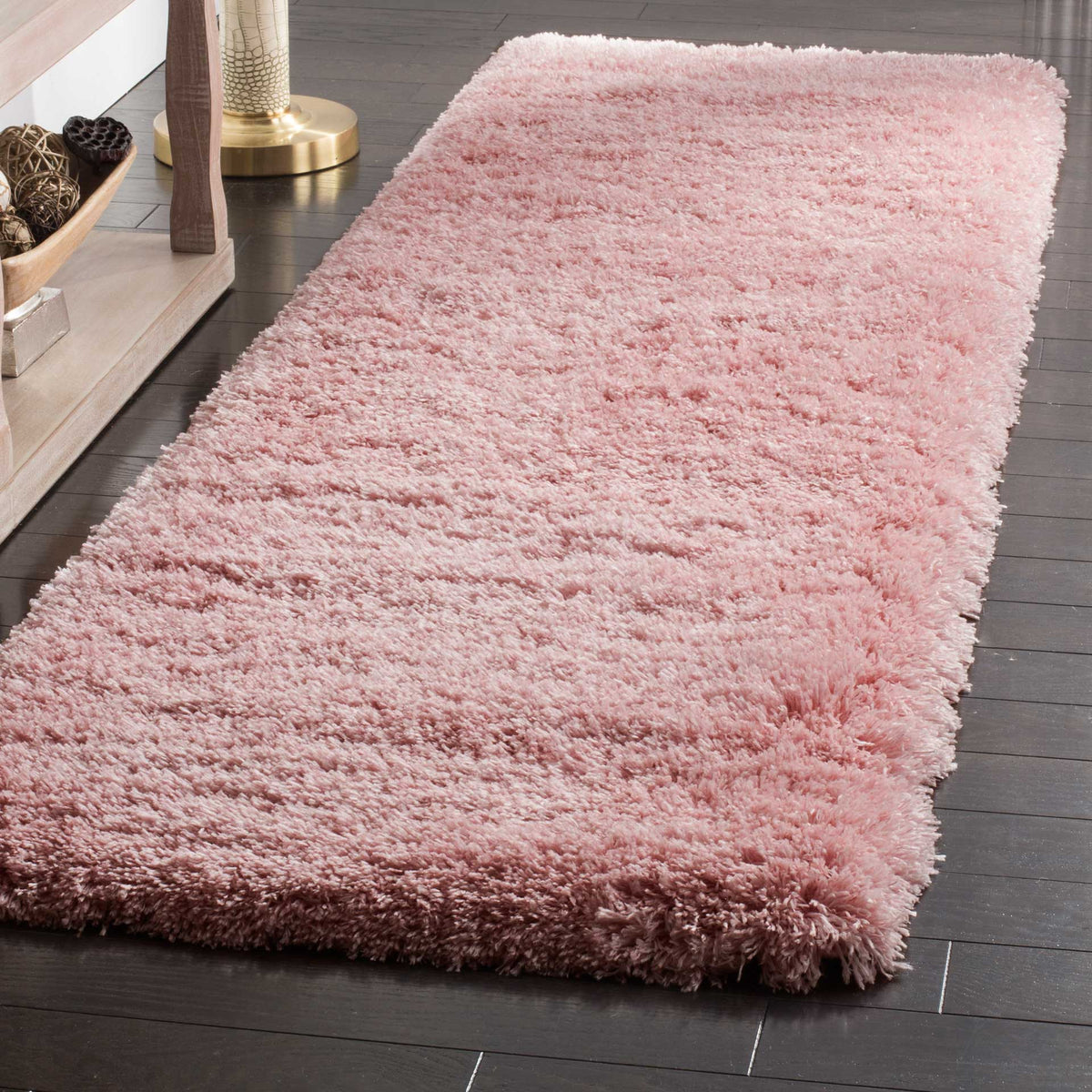 Plush pink shag creates a cozy surface with softly textured edges