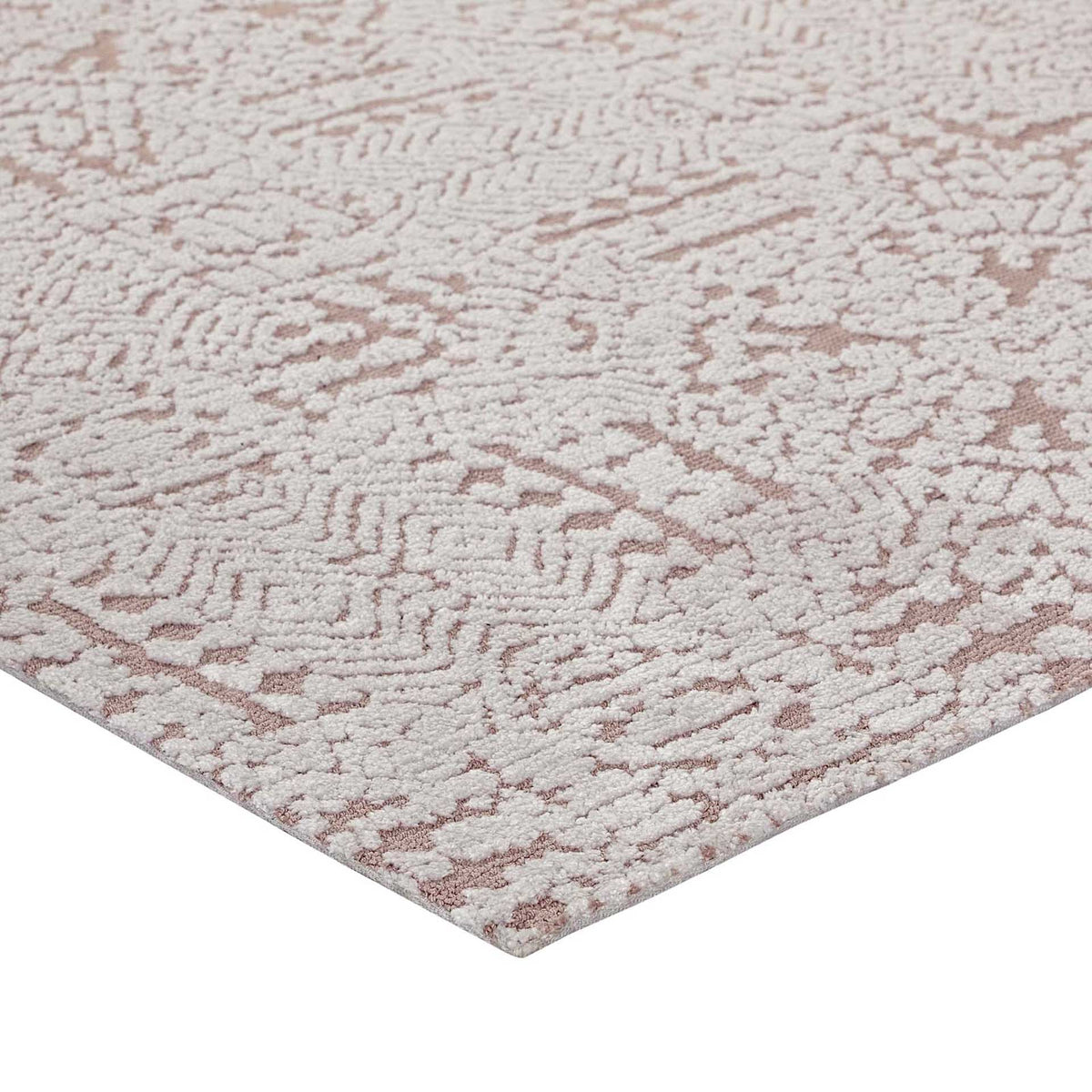A softly textured edge highlights ivory pile and muted rose motifs
