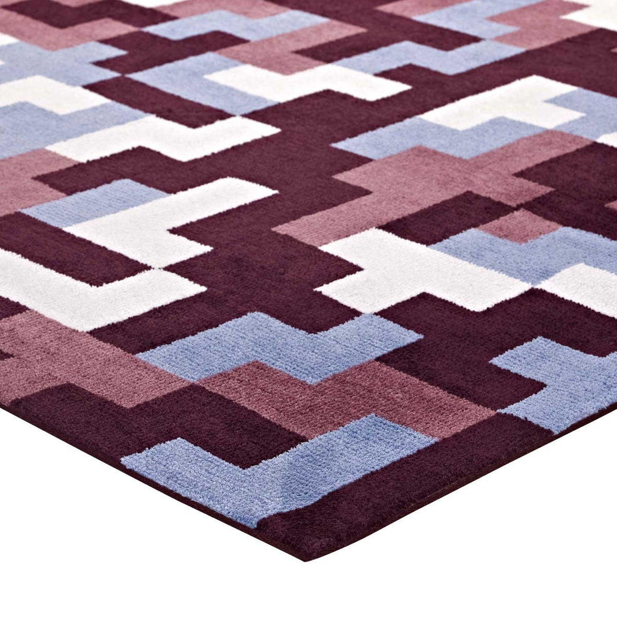 Rich burgundy and soft blue blocks run to the rug's crisp bound edge.
