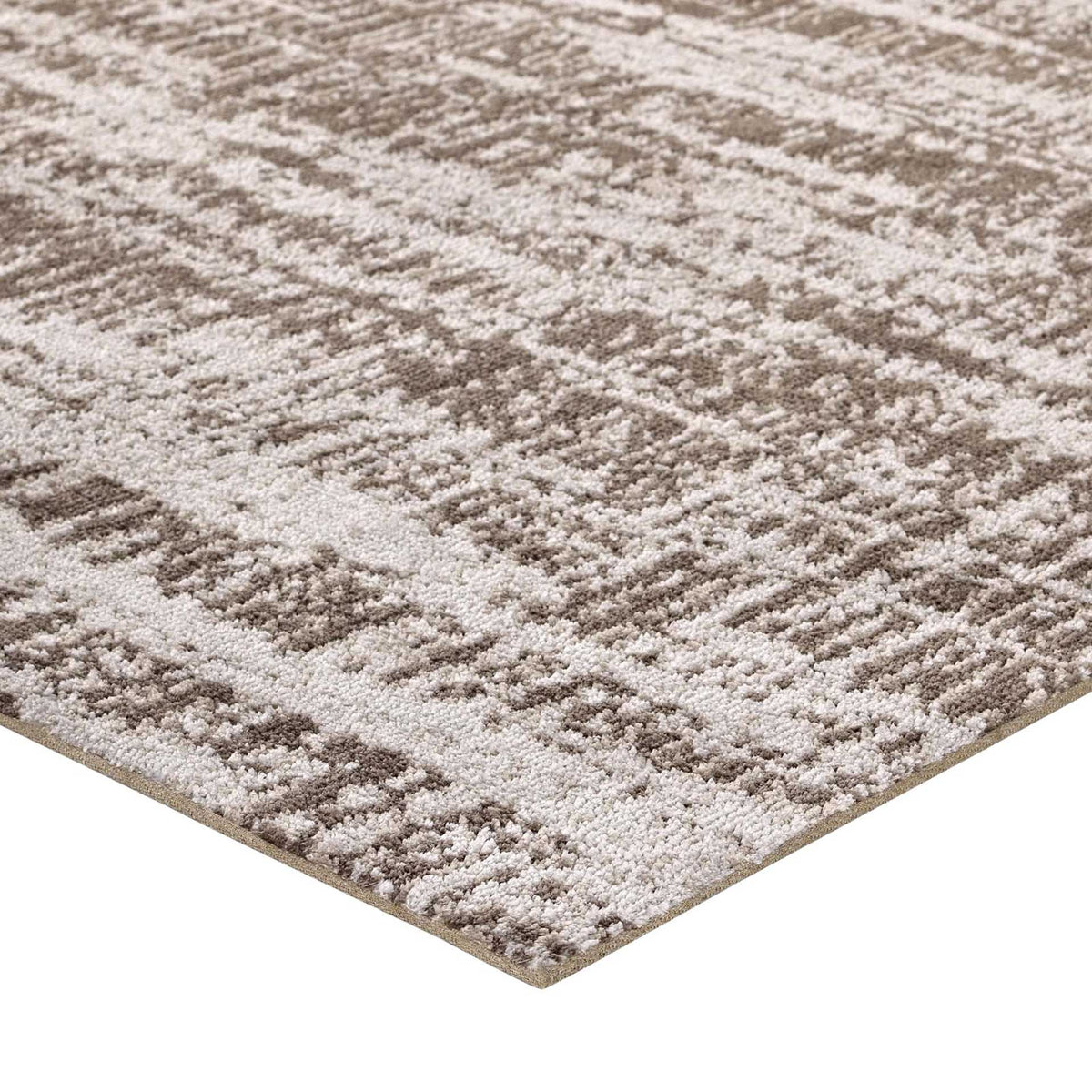 Dense, plush pile meets a neatly finished edge in warm neutral tones.