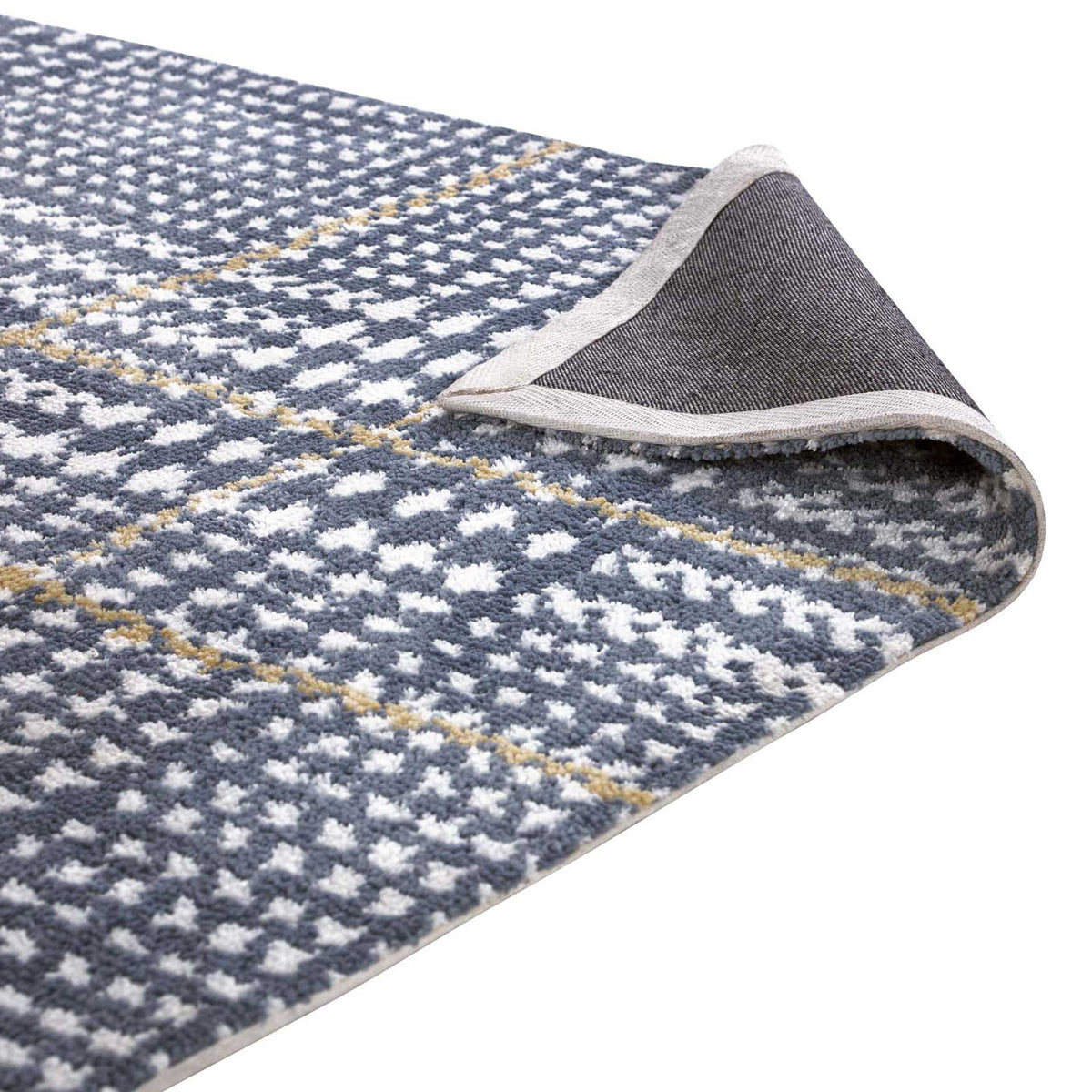 A folded edge reveals dark woven backing beneath soft blue, ivory, and citron fibers