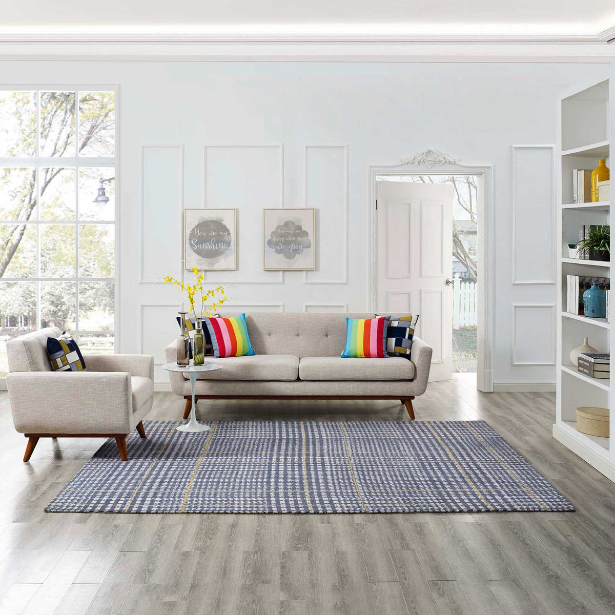 Blue and ivory abstract plaid with subtle citron accents anchors a bright seating area