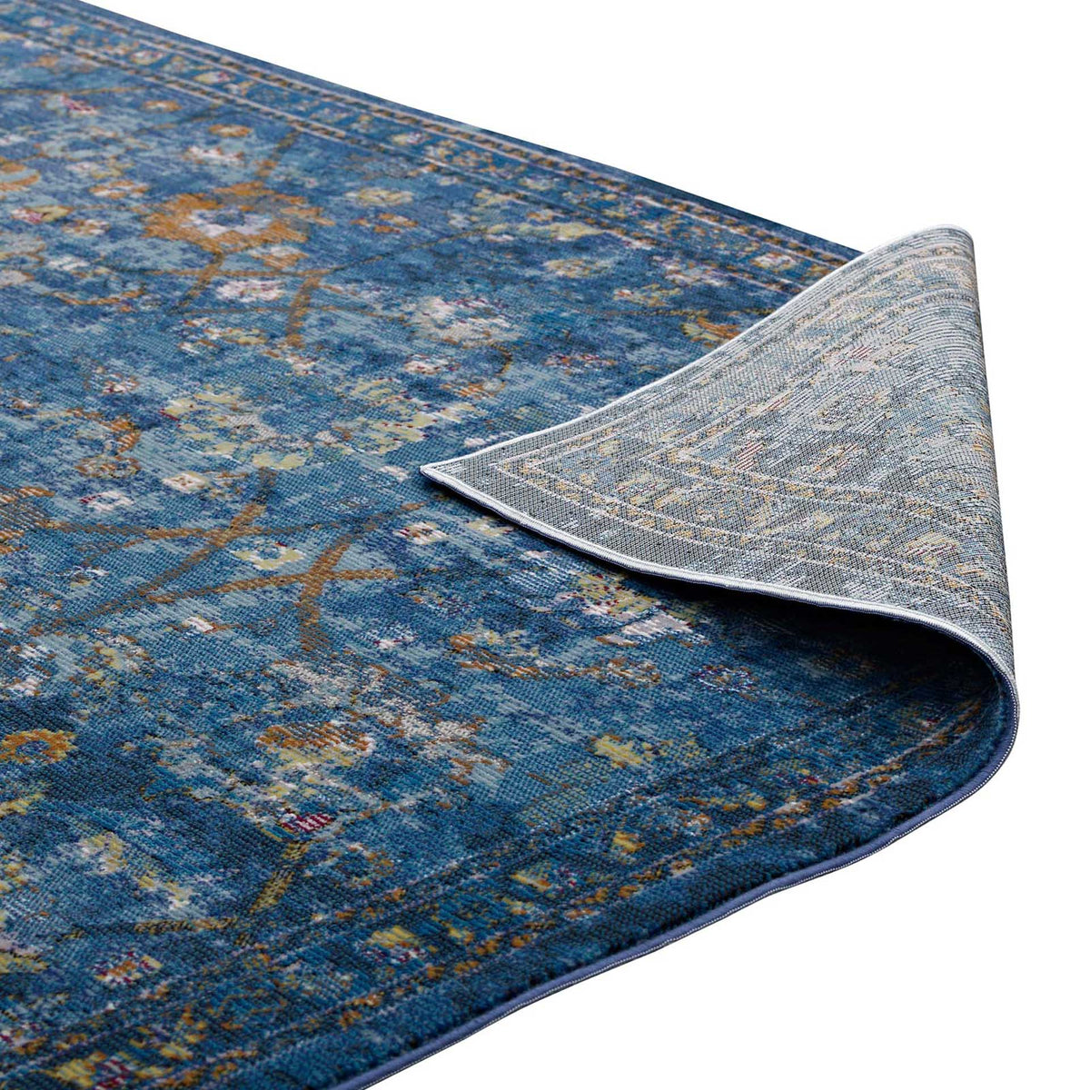 A light woven underside complements the low-pile, deep blue floral surface