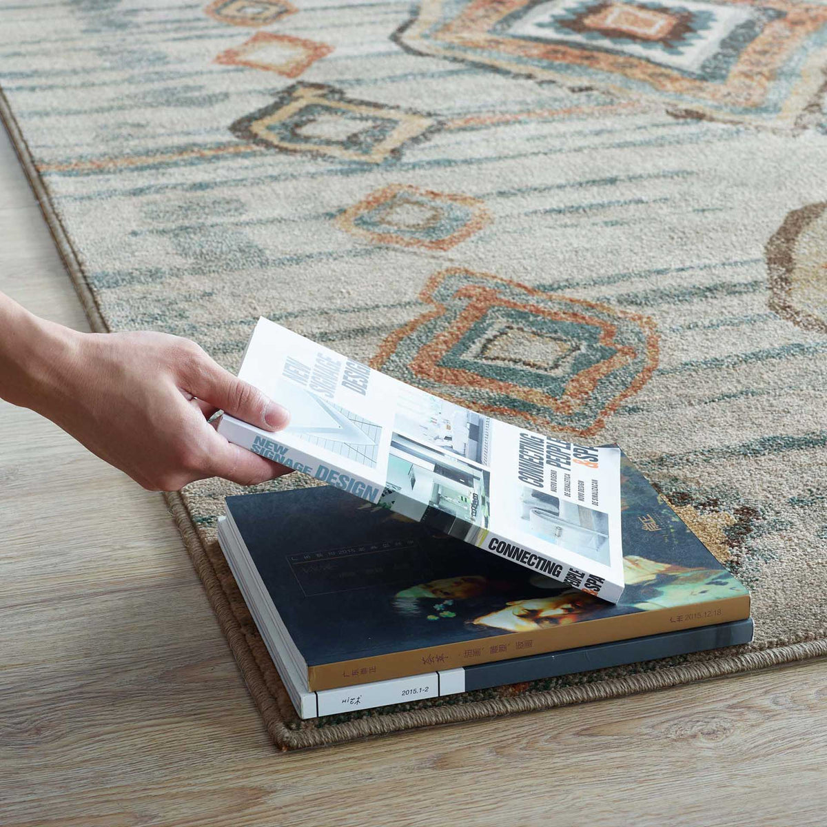Muted geometric motifs and a finished edge soften a light wood reading nook