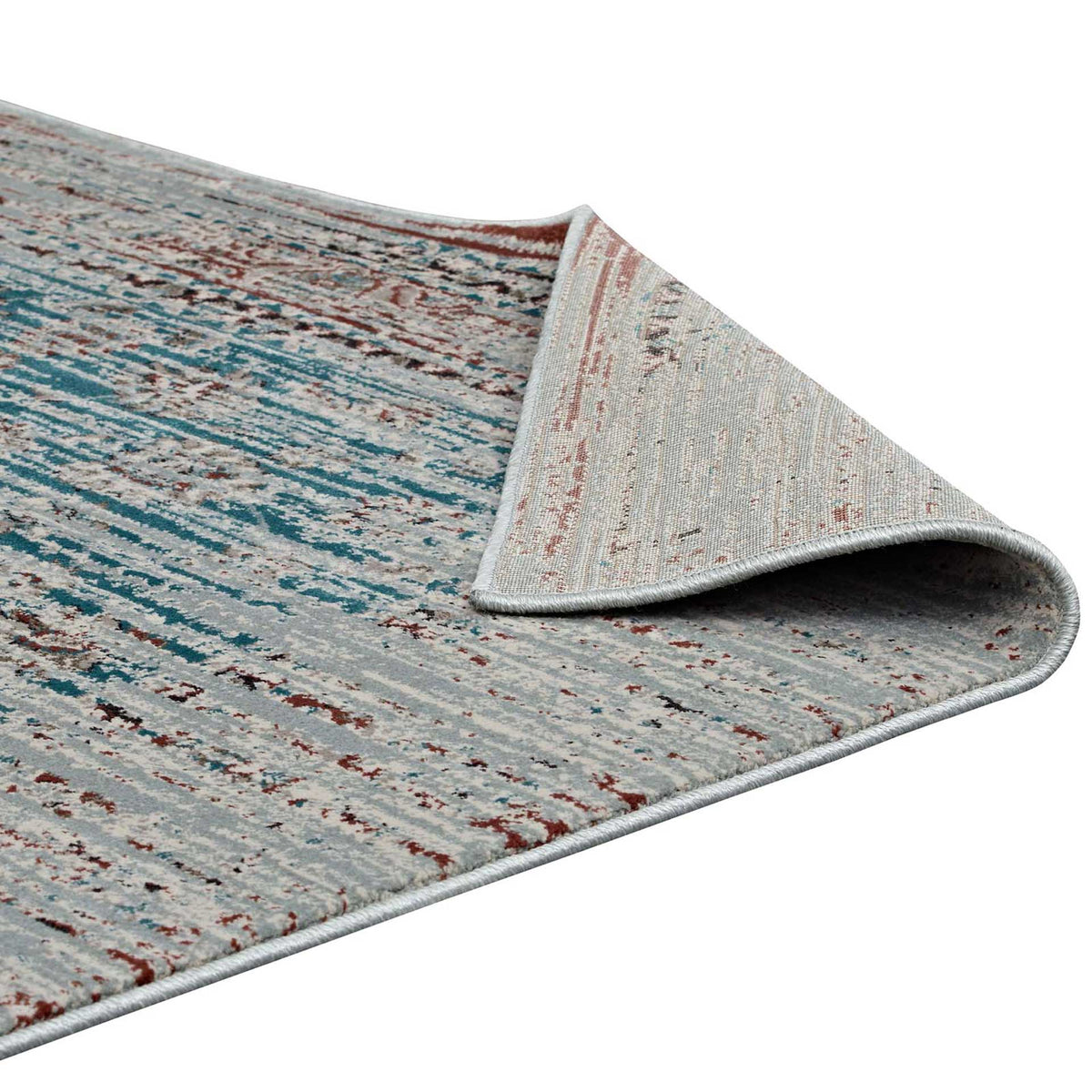 A turned-back corner reveals the rug's woven underside and neatly bound edge