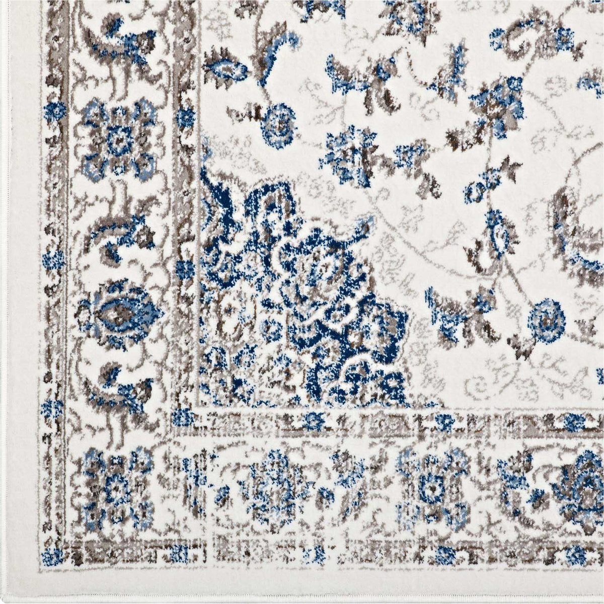 Blue and taupe floral motifs wind through the ivory rug's distressed border