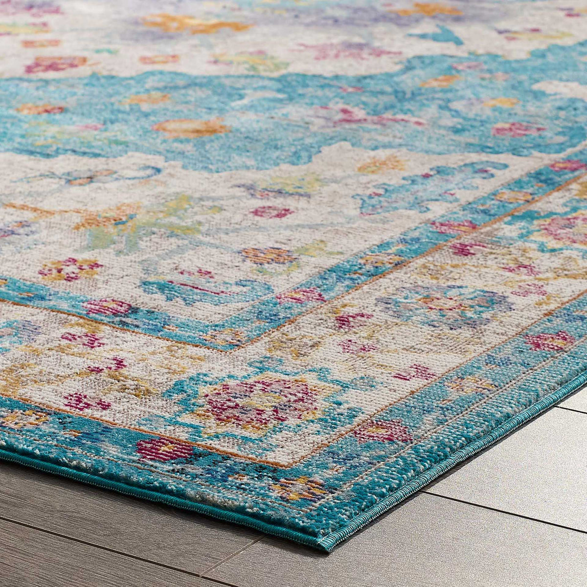 Bright blue binding outlines layers of ivory, pink, and gold floral details