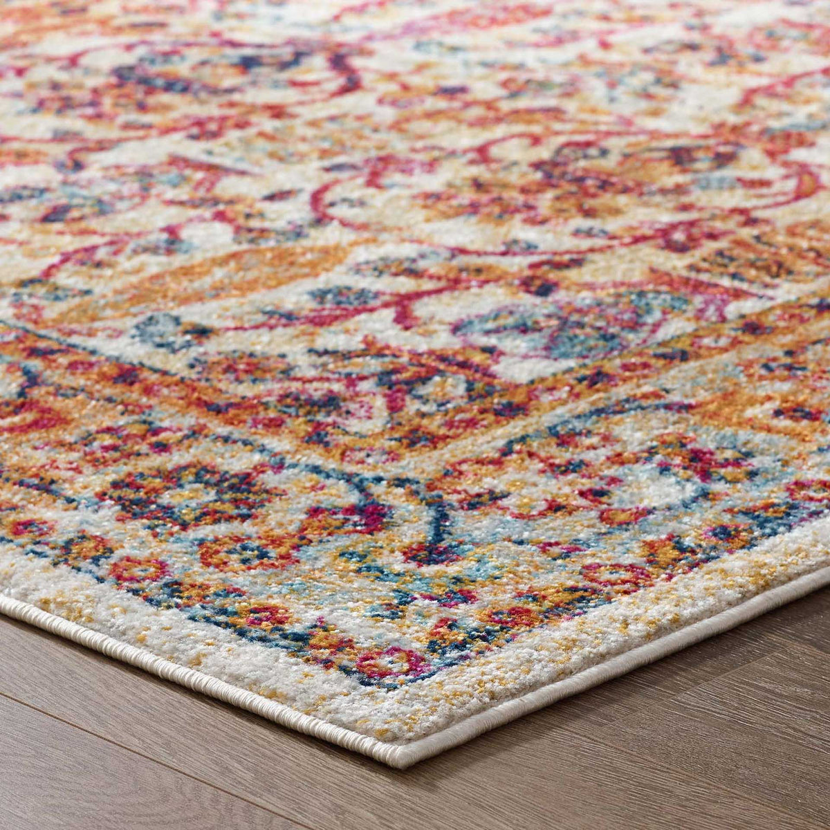 A clean ivory edge gives the richly colored floral border a neat, tailored finish.