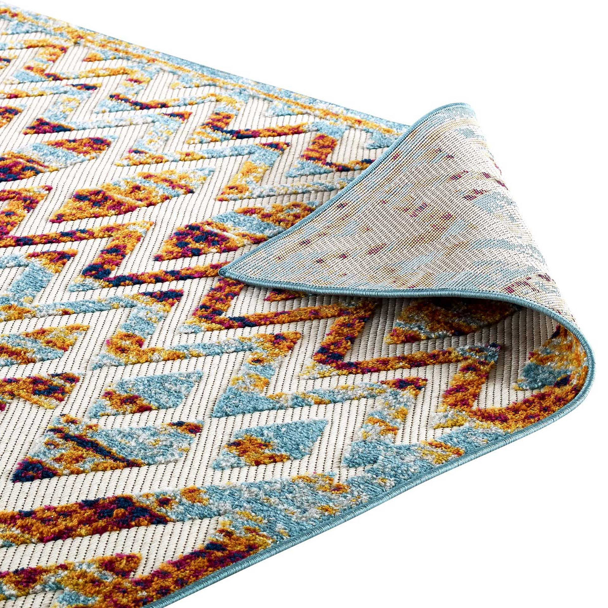 A flexible woven underside and blue edge binding complete the colorful geometric rug