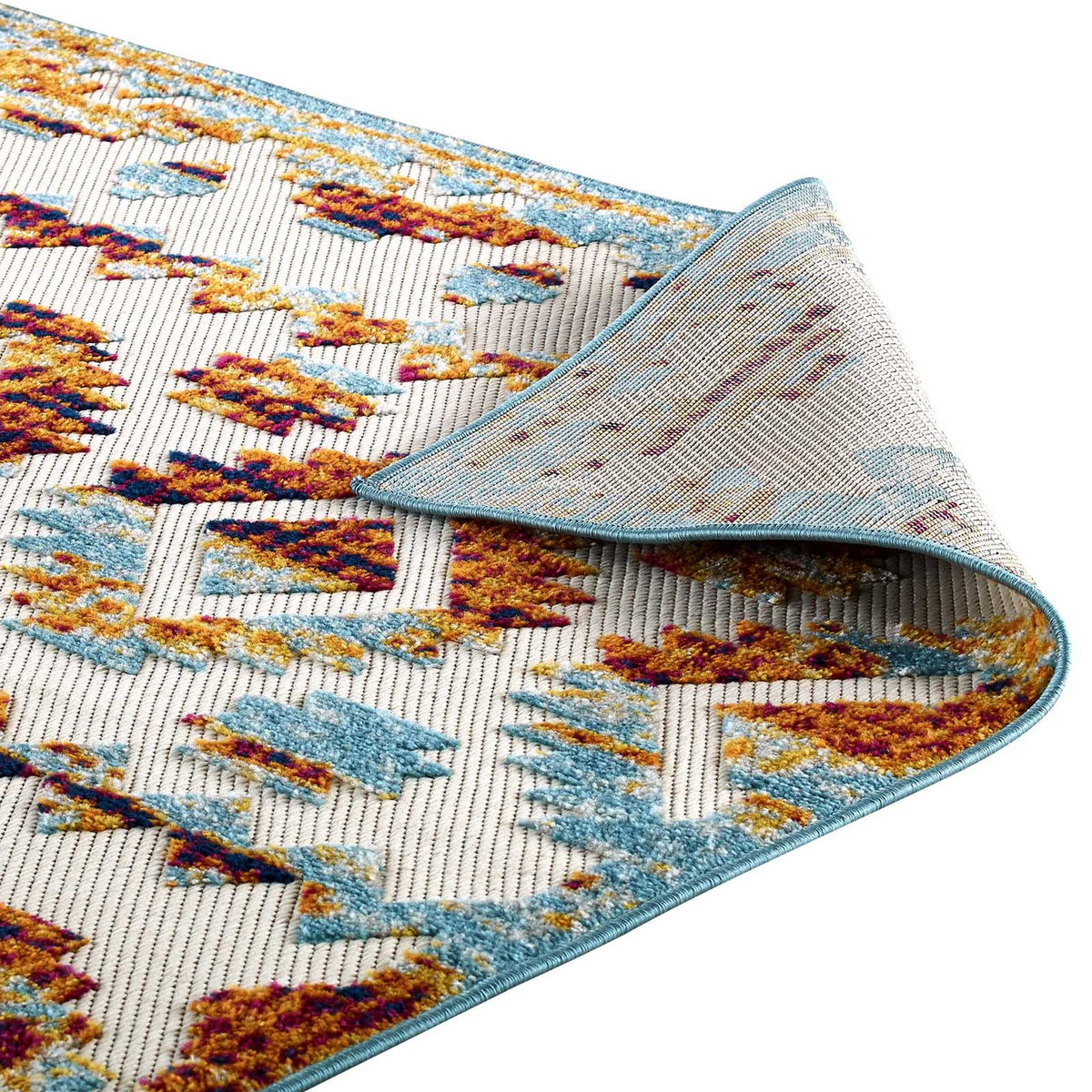 A flexible woven underside meets blue bound edging beneath multicolored geometric motifs