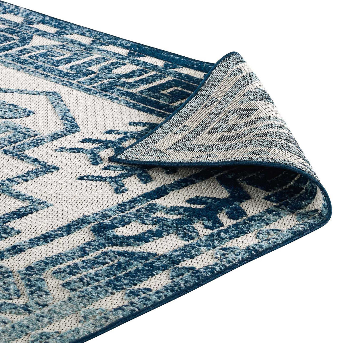 Bound blue edges and woven backing complete the rug's flexible construction