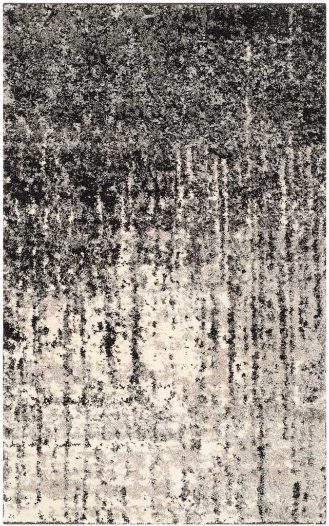 Small accent rug pairs dark speckling with light gray in a softly faded abstract design