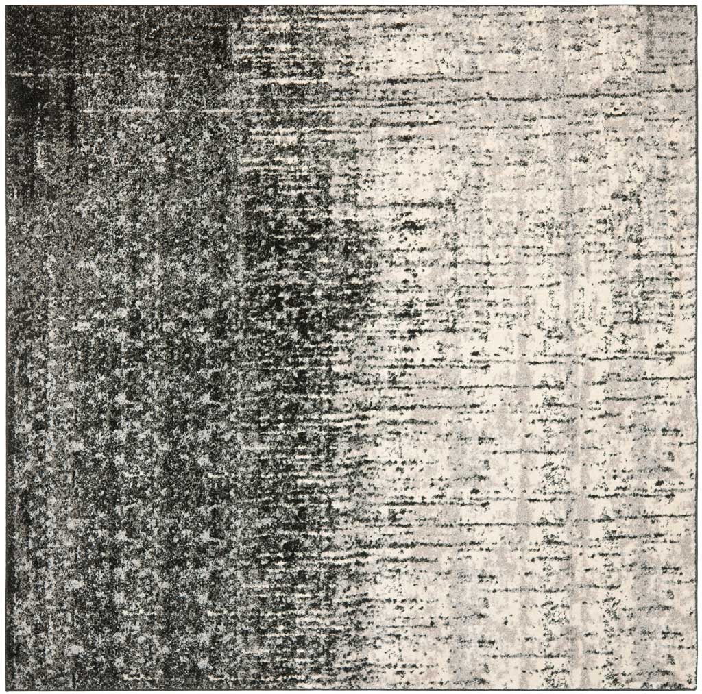 Square rug blends black and light gray in a weathered abstract design with a side-to-side fade