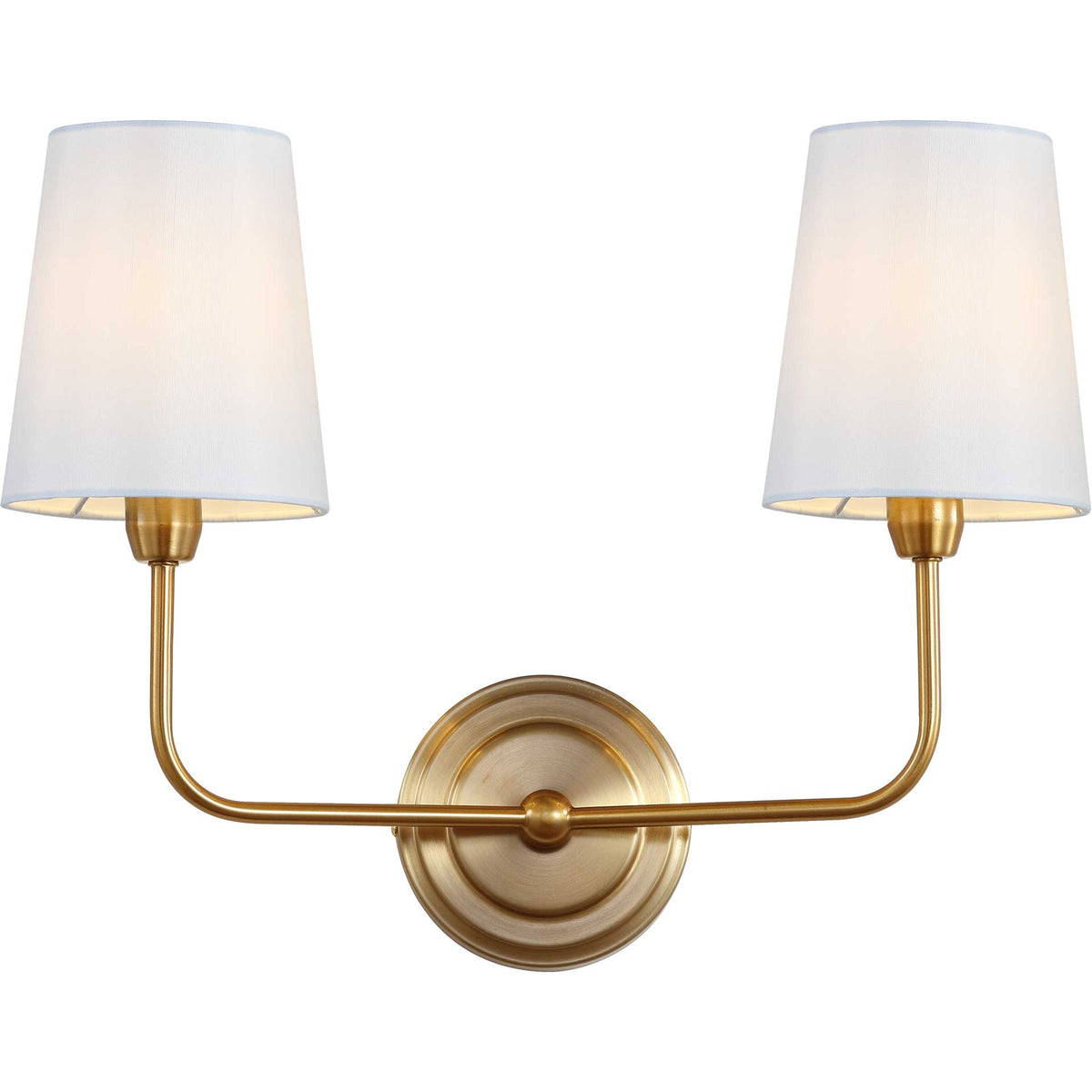 Warm light glows through twin fabric shades above sweeping brass-finished arms.