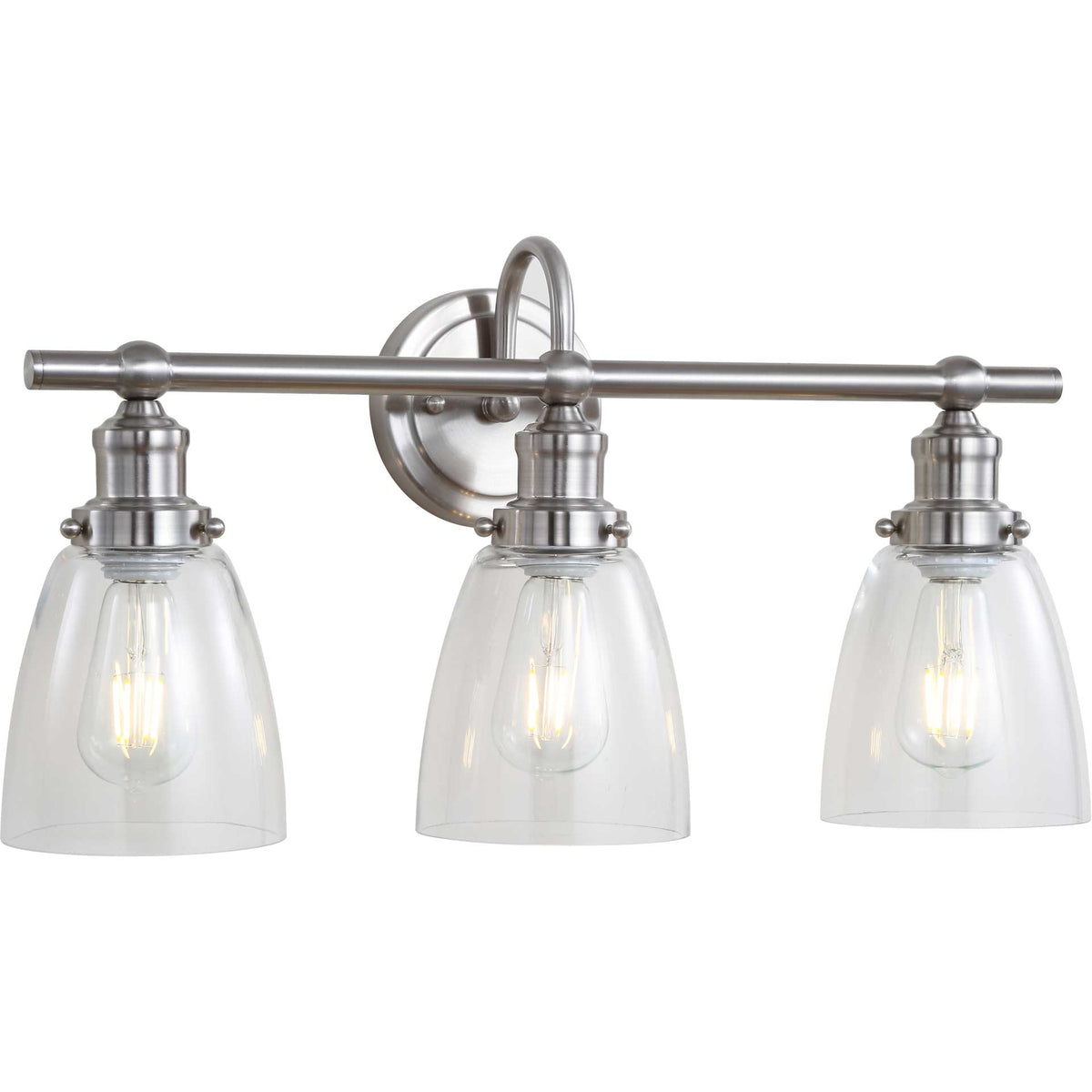 Warm bulbs glow inside the three clear glass shades of a sleek nickel-finished wall sconce