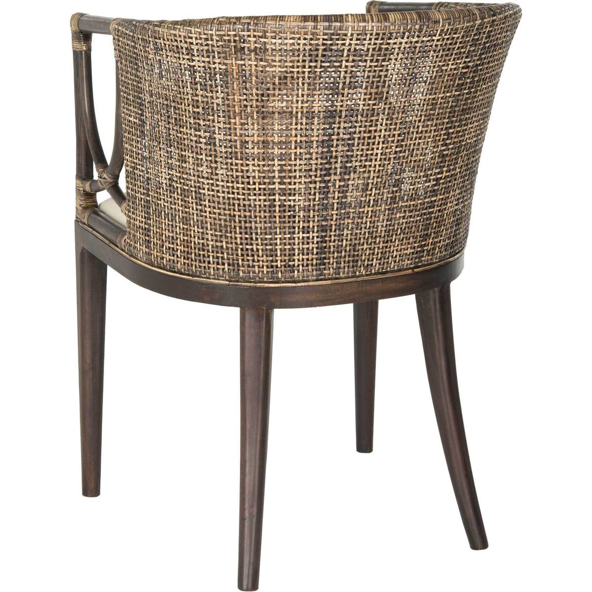 A sweeping rattan weave forms the chair's curved back above slender dark mahogany legs.