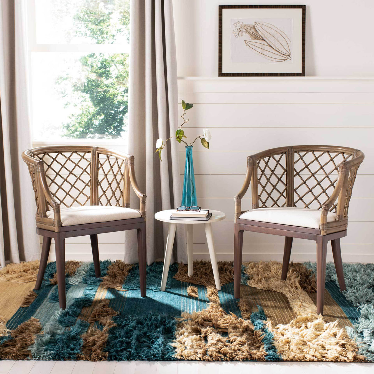 Curved lattice-back chairs with white cushioned seats and tapered wood legs create a welcoming seating nook.
