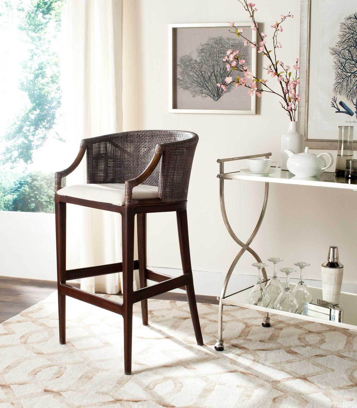 A white-cushioned bar stool pairs a wraparound woven back with sleek wood footrests